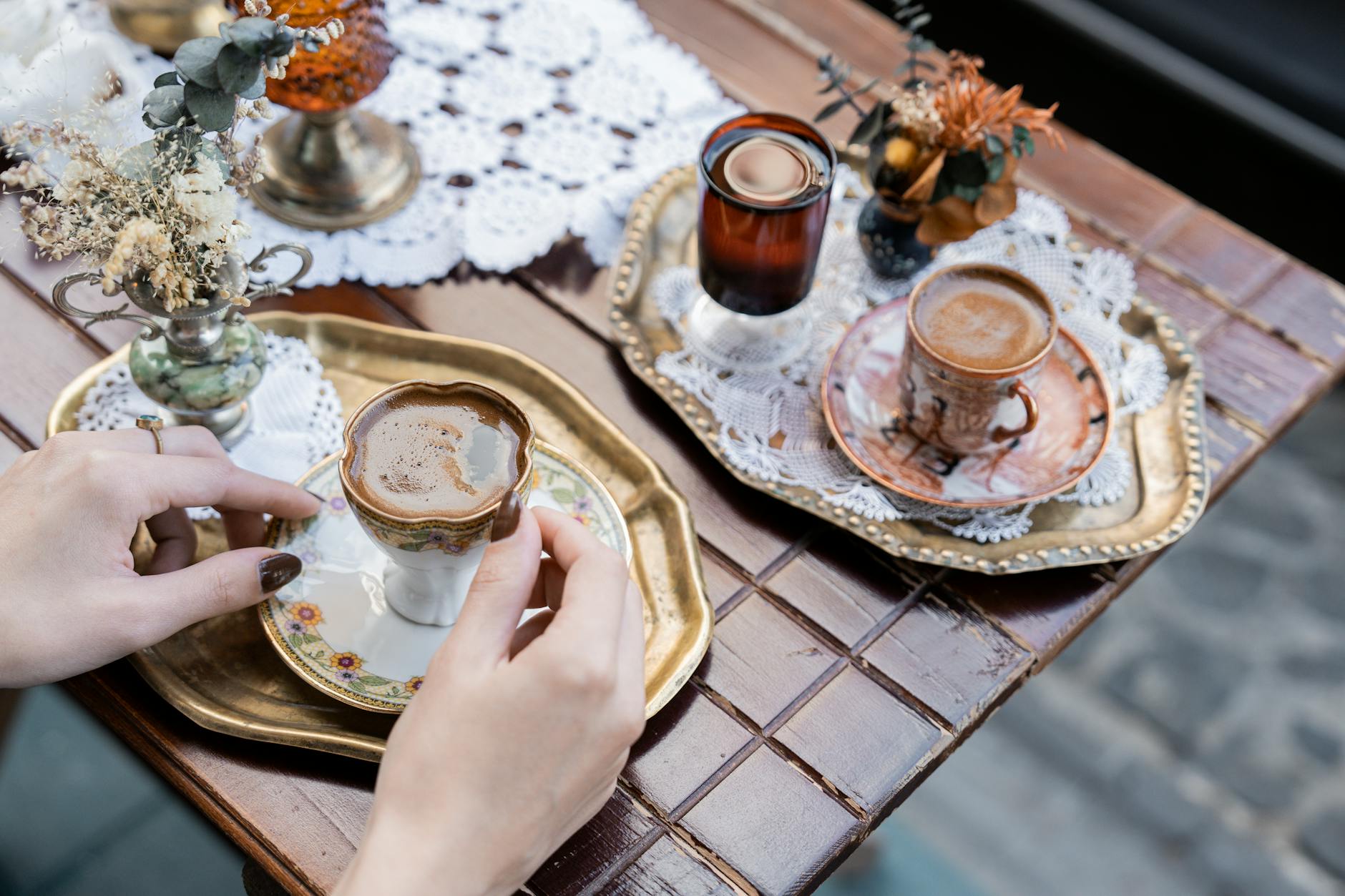 Enjoying Turkish coffee served in ornate cups on an autumn day in Istanbul.