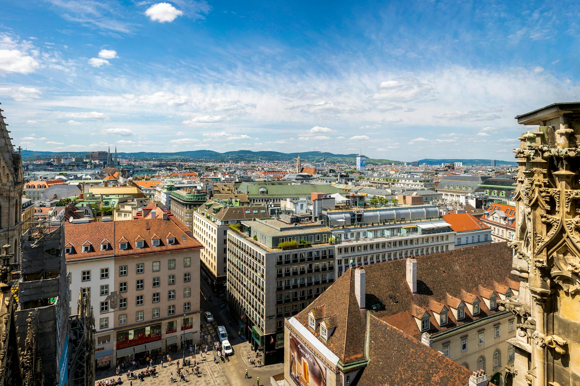 Stunning aerial view of Vienna showcasing urban architecture under a bright blue sky.