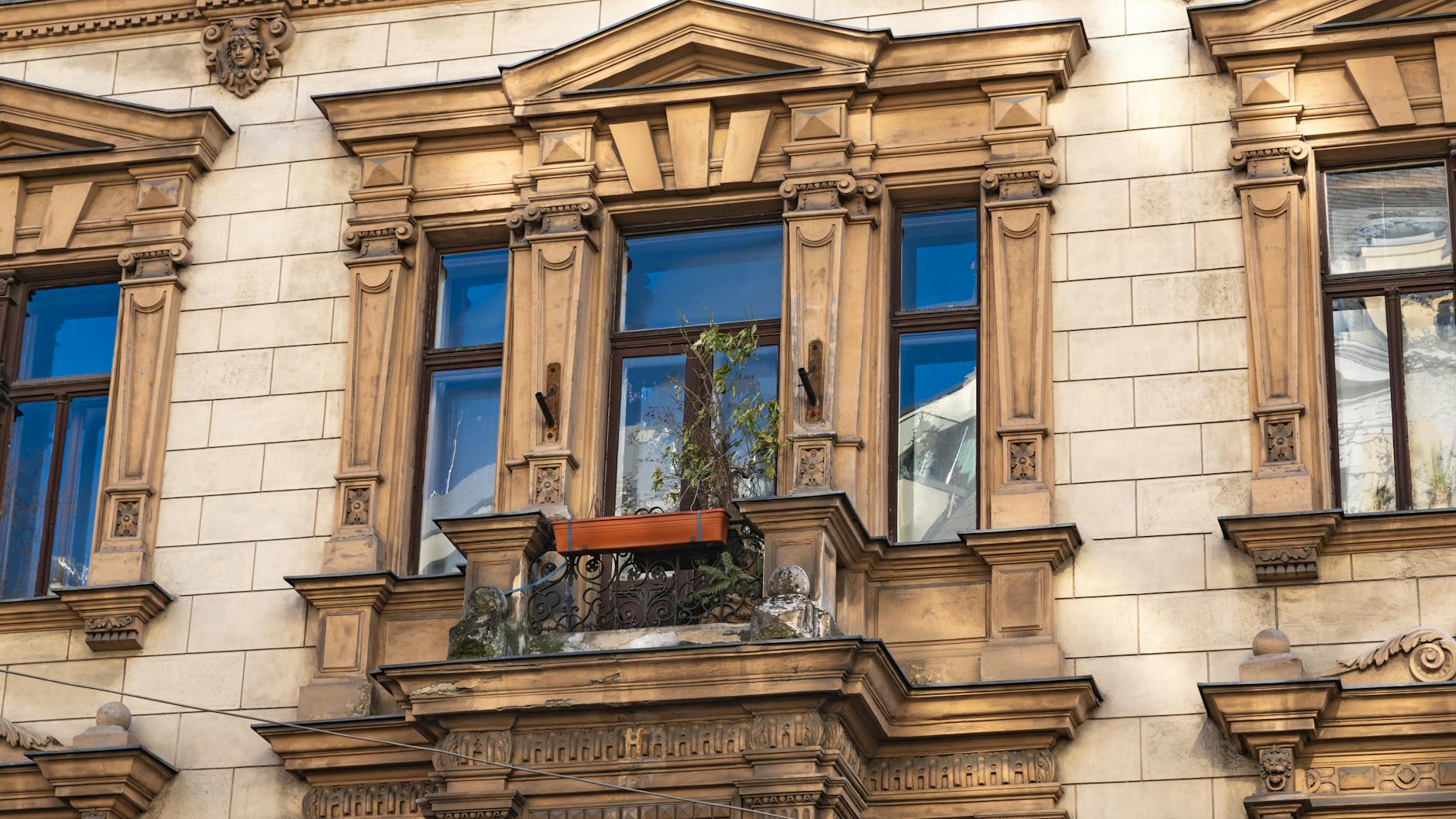 Elegant architectural details of a classic historical building facade in Vienna, Austria.